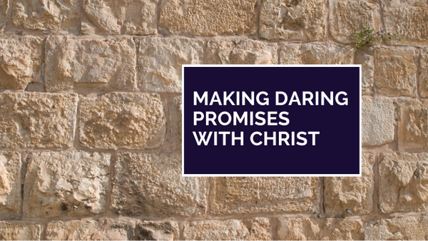 making promises with Christ in front of brick wall