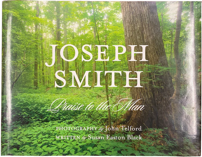 Book cover with The Sacred Grove and 'Joseph Smith: Praise to the Man' text