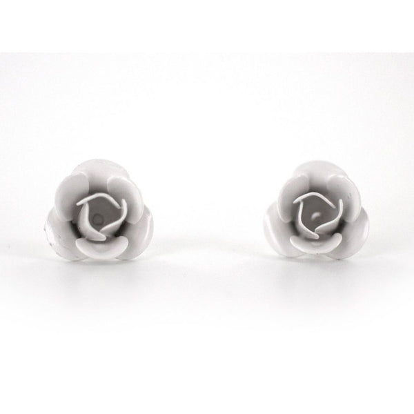 A pair of white stud earrings designed to resemble flowers, displayed against a plain background.