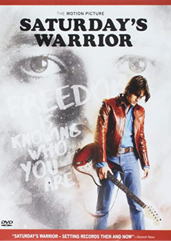 DVD cover of 'Saturday's Warrior' featuring a male character in a leather jacket with a guitar, and text including the title and a quote.