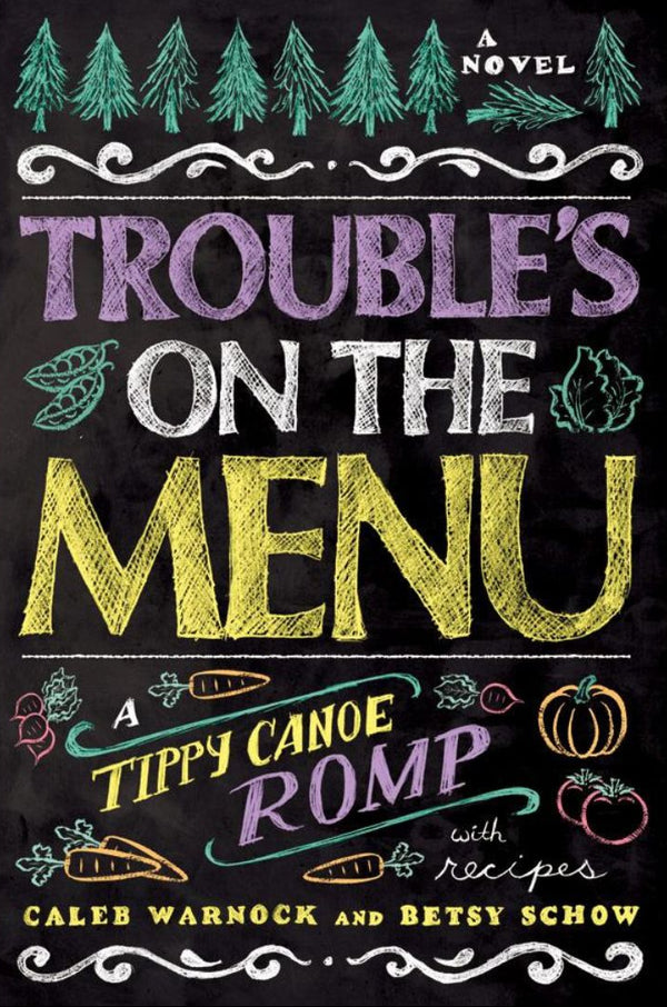 Book cover of 'Trouble's On The Menu' featuring a black and white illustration of a menu with colorful food and leafy decorations.